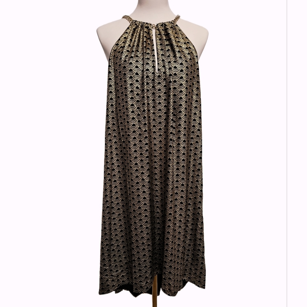 Michael Kors- New with tag. Highlow dressSize Medium. Black and God color